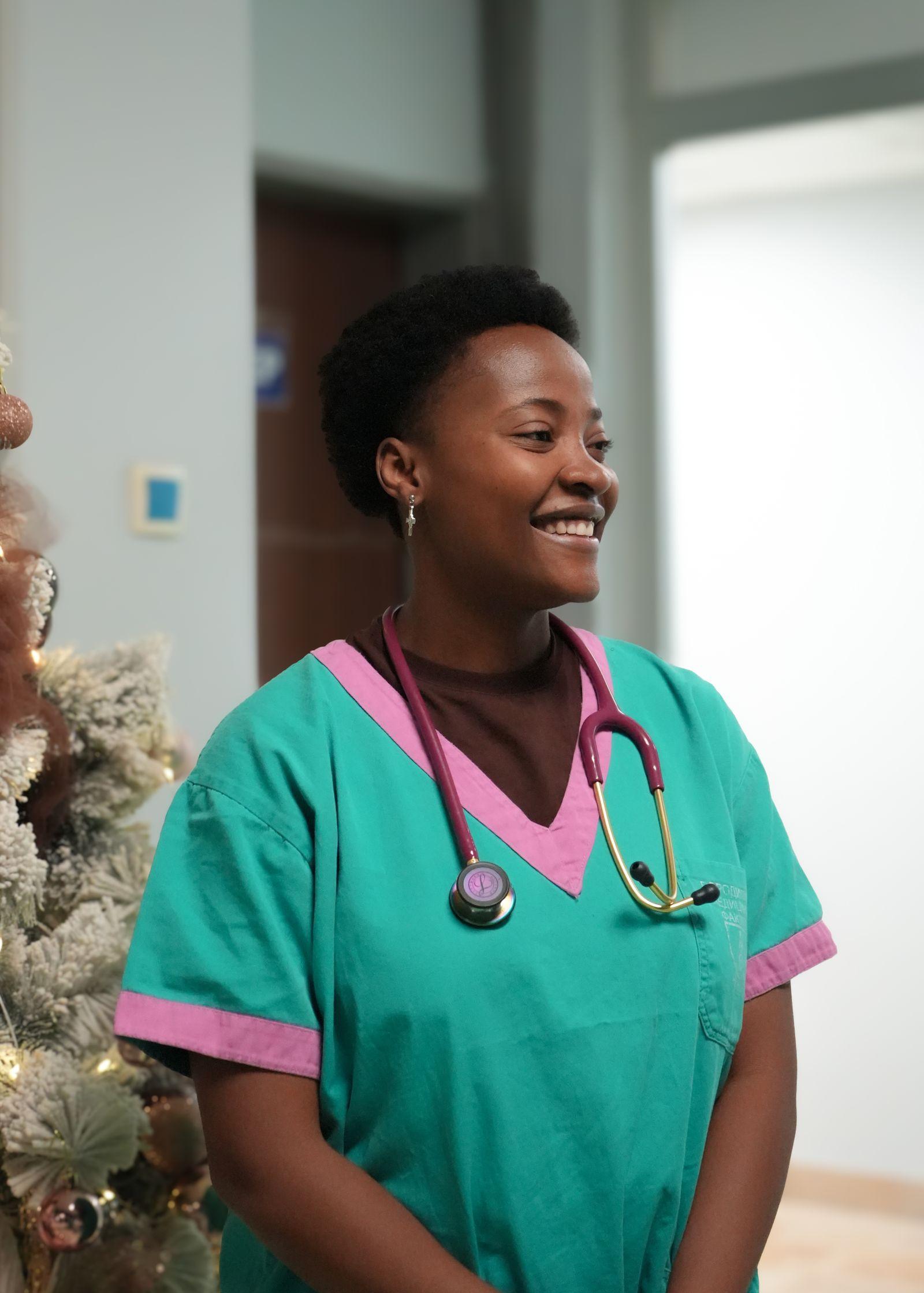 A nurse at work in a hospital corridor